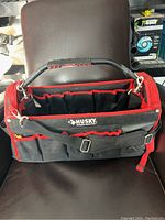 Front view of Husky tool carrier with handle and exterior pockets