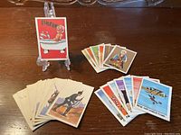 Display of 21 A&BC Topps British trading cards showing cartoonish characters and military figures with colorful backgrounds.