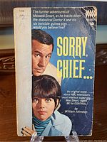 Front cover of 'Sorry Chief', showing Maxwell Smart and Agent 99 with text and some wear visible.
