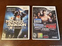 Front cover of Michael Jackson The Experience and WWE SmackDown vs Raw 2010 Nintendo Wii game cases.