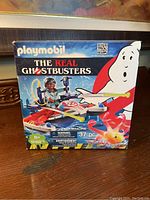 Front of the Playmobil Ghostbusters set box showing branding, figure, vehicle, and number of pieces