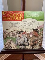 Front cover of the Lone Ranger vinyl album with comic style illustration and title text.
