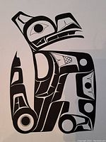 Close-up of black and white owl print with tribal design.