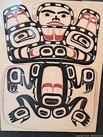 Full view of the embossed print showing the stylized bear figure with characteristic black, red, and white coloring.