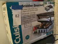 Photo of product box showing branding, features, and image of the electric griddler appliance.