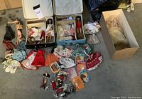 Full view of collection showing vintage Barbie dolls, clothes, magazines, accessories, and two play cases.