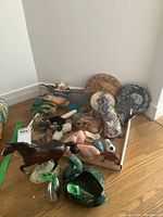 Group photo showing assorted animal figurines including horse, swans, birds, mammals in ceramic, clay, and resin