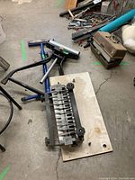 Overall view of two saw stands and dovetail jig on garage floor