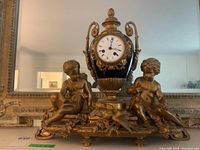 Front view of entire clock on mantel