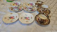 All teacups, saucers and plates arranged on table