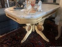 Top side view showing marble surface and decorative figurines (not included).