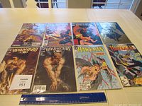 Eight Hawkman comic books laid out in two rows on a table, showing front covers with various action poses and artwork.