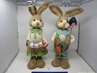 Photo of both bunny figurines standing side by side showing overall appearance and condition.