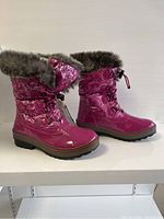 Side view of both pink Cougar kids winter boots showing shiny waterproof material and fur trim