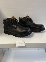 Side angle view of black ladies comfort lace-up shoes showing padded collar and sole.