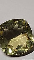 Close-up image of the lemon citrine gemstone showing facets and clarity.