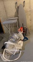 Photos of laundry drying and cleaning items including drying rack, ironing board, hangers, mop, dustpan