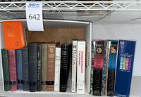 Photo showing the spines of 15 various religious books including prayer books, study Bibles, and Bible handbooks.