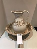 Jug and bowl together showing size, shape, and decorative details