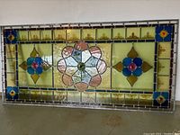 Front view of rectangular stained glass panel showing full decorative design.