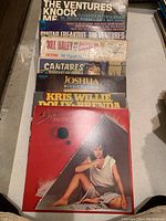 Photo showing a stack of vinyl records including The Ventures Knock Me Out, Bill Haley and others.