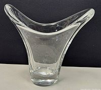 Front view of the Daum France crystal vase showing the wide asymmetric flared rim and thick base.