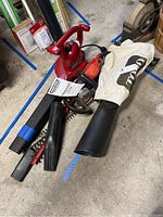 Photo of Toro blower with bag and two trimmers showing condition and accessories
