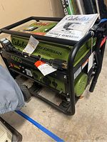 Front left angle showing control panel, Cabela's branding and included manual