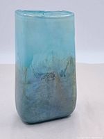 Front view of vintage glass vase showing blue to gray gradient and overall shape.