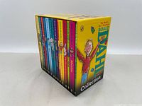 Boxed set of 15 Roald Dahl children's books showing spines with titles and colorful designs.