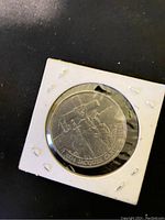 Reverse side of 1984 Canadian coin featuring Jacques Cartier image with year and name.