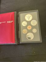 Full view of the open coin set inside red Royal Canadian Mint cover.