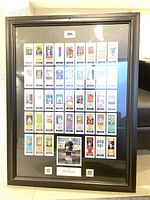 Framed display of Super Bowl ticket stubs with 40 tickets visible in a black frame under glass.