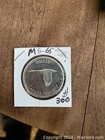 Obverse side of 1967 Canadian silver dollar coin showing flying goose and engraving MS-65.