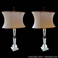 Pair of lamps front view showing bases, columns and oval shades