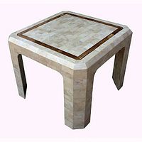 Front-left angle view of square tessellated stone table top and legs