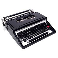 Side angled view showing keyboard, red shift key and open typebar area.