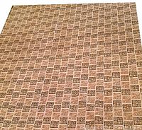 Full view of one barkcloth fabric panel fully spread, showing the entire repeated pattern of small squares containing Egyptian hieroglyphs in gold on a cream textured background.