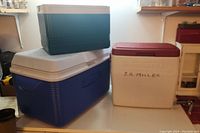 Photo showing the three coolers stacked with clear view of size and colors.