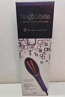 Front of box showing product brand Pro Cabello and image of the purple hair straightening brush.