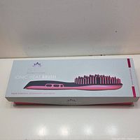 Boxed Sutra Ionic Heat Brush with product picture and branding.
