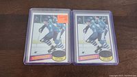 Two Michel Goulet rookie hockey cards in protective sleeves, showing front view with player skating on ice in Nordiques blue uniform.