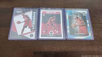 Three OG Anunoby rookie basketball cards placed side-by-side showing front designs.