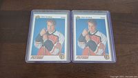 Two identical Peter Forsberg rookie hockey cards from the 1992-93 Upper Deck series in clear protective sleeves, laid flat on a wood surface.
