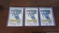 Photo of three identical Peter Stastny rookie hockey cards in protective sleeves.