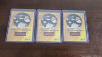 Three Shohei Otani Japanese High School Sensation baseball cards in protective cases on dark surface.