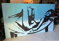 Straight-on photo of oversized canvas art showing its style and subject.