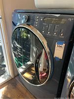 Front view showing control panel, round door and overall condition