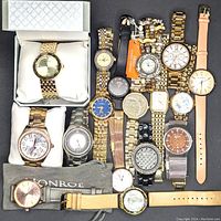 Full view of all 16 ladies fancy dress watches showing mixed metal and leather bands, various dial colors and designs