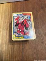 Stack of Marvel Universe Series 2 trading cards featuring Spider-Man on top, color borders and comic artwork.